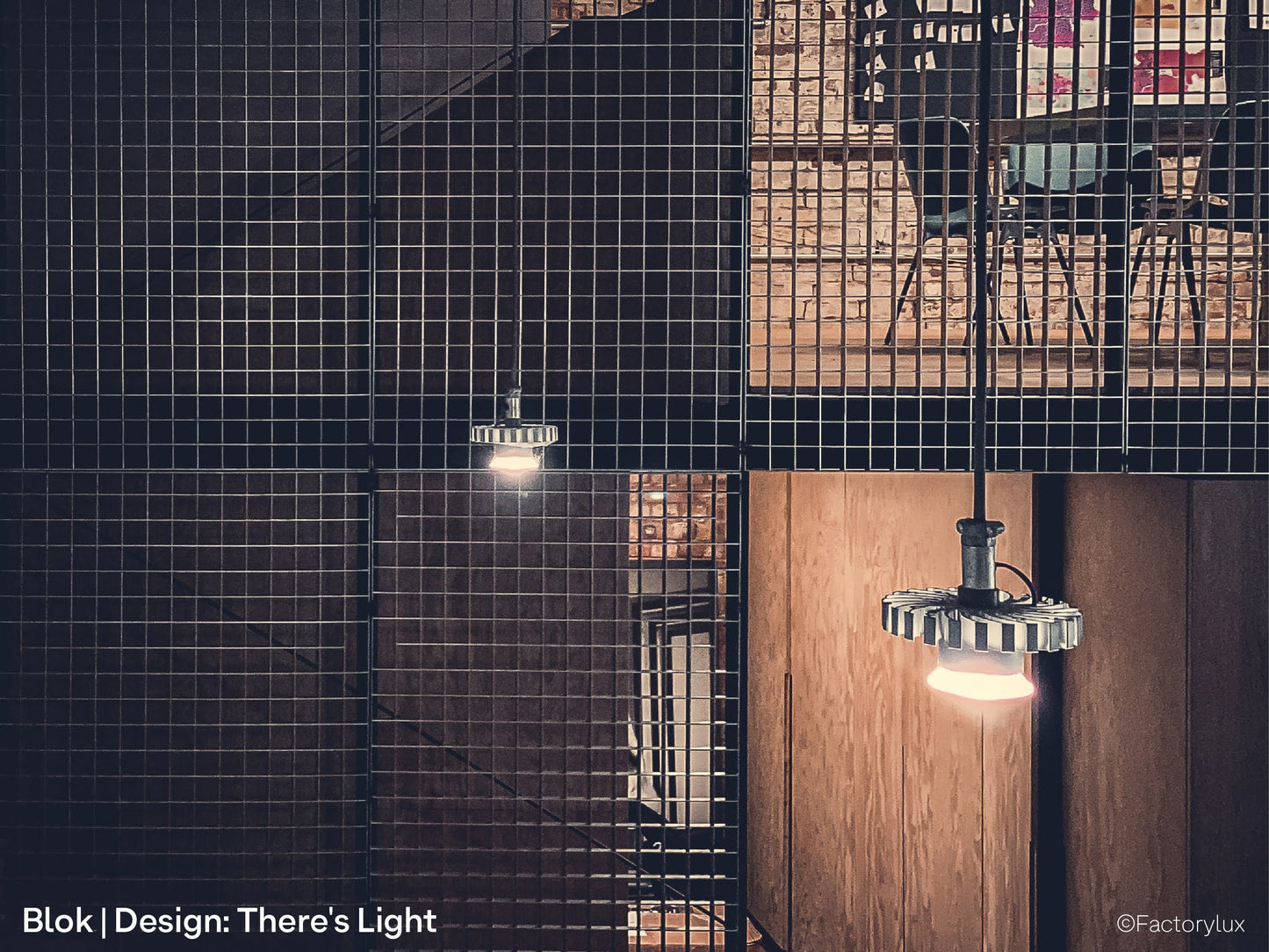 Contemporary industrial office interior in London with galvansied steel mesh and budget architecural pendant lighting