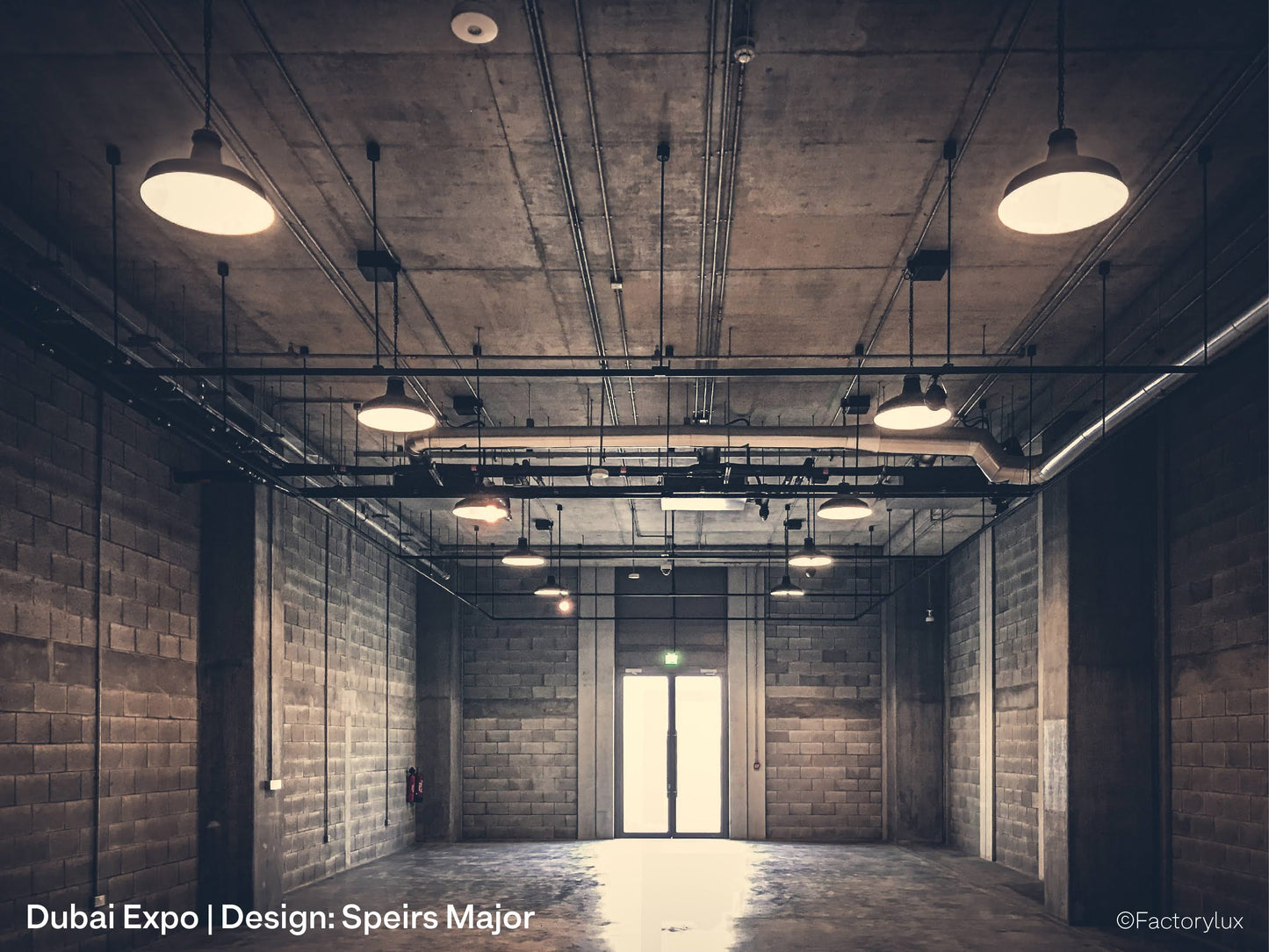 Expo exhibition centre in Dubai, with beton-brut concrete walls and raw aluminium architectural pendant lights