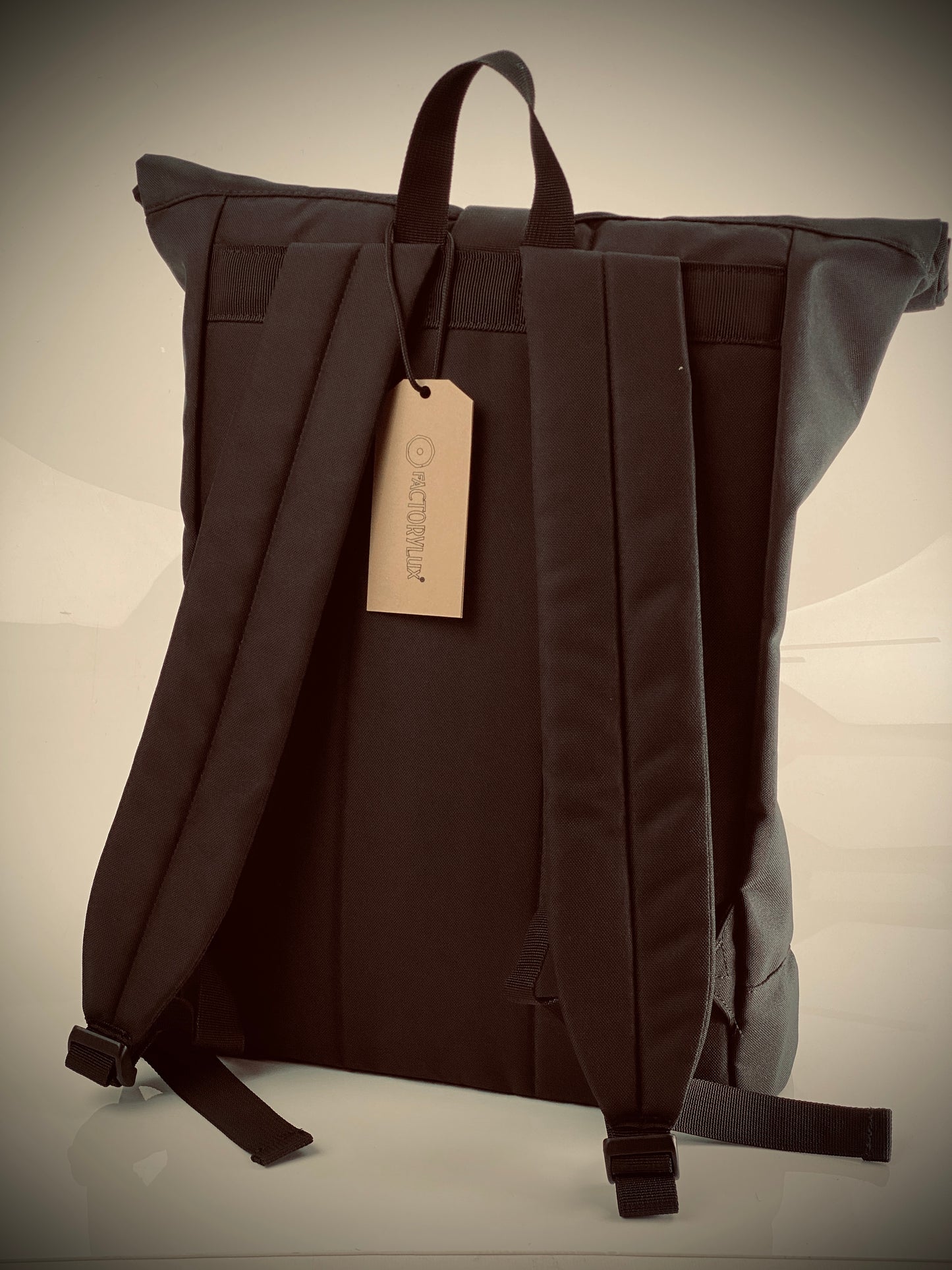 Rear view of Factorylux 20 litre, roll top, black recycled polyester bag.