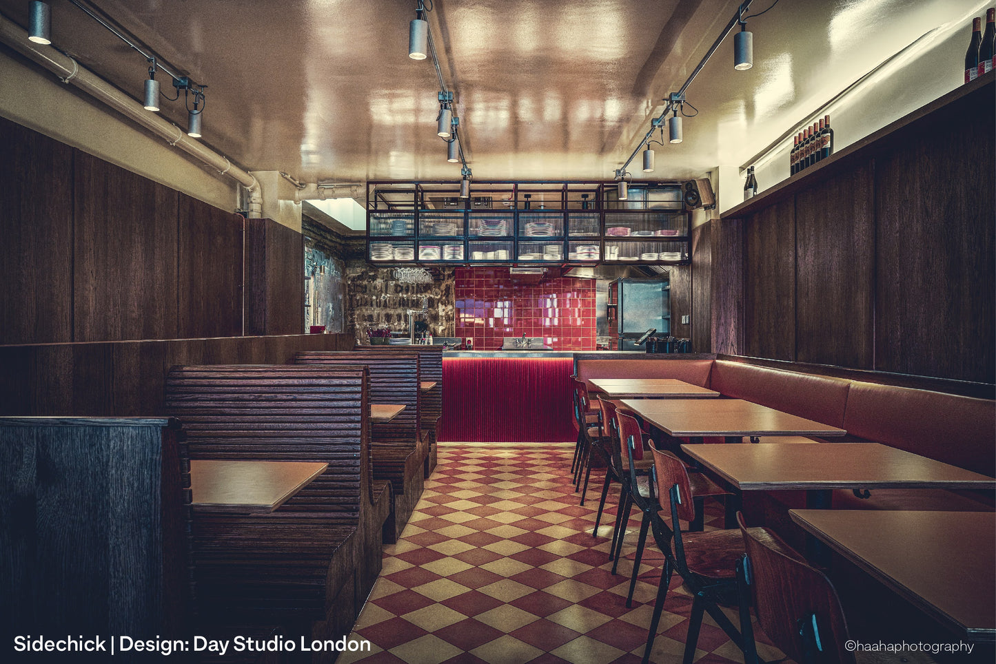 Stainless steel tube track system supplying power and data to spotlights in a restaurant