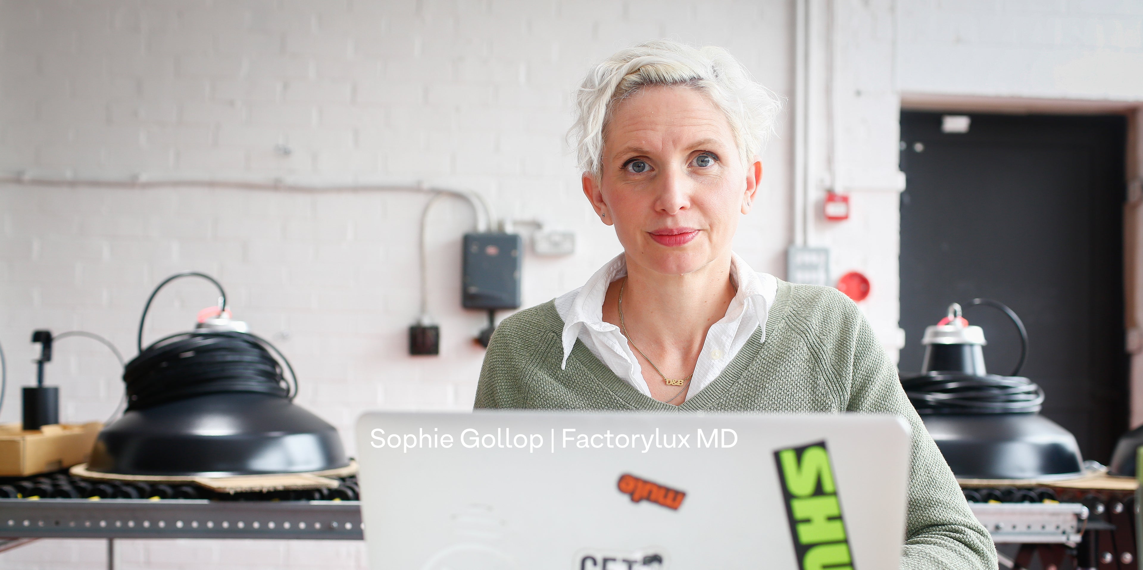 Factorylux MD Sophie Gollop at work at HQ among matte black Reflekter pendants