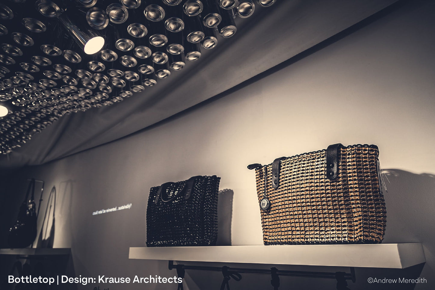 Luxury handbag made of sustainable materials on display with spotlight at Bottletop's London retail store